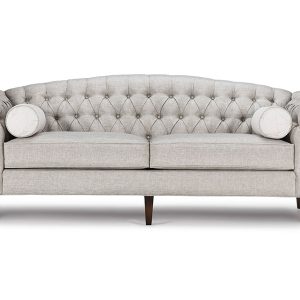 The Belmont Sofa features hand-tufted shelter arms and gently curved camelback, and long and tapered wood legs.