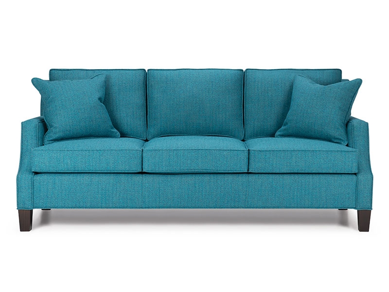 The Cooper/ Crawford sofa features stylish scoops on slender track arms, box back cushions and a plain front edge, tapered leg or tapered leg and base.